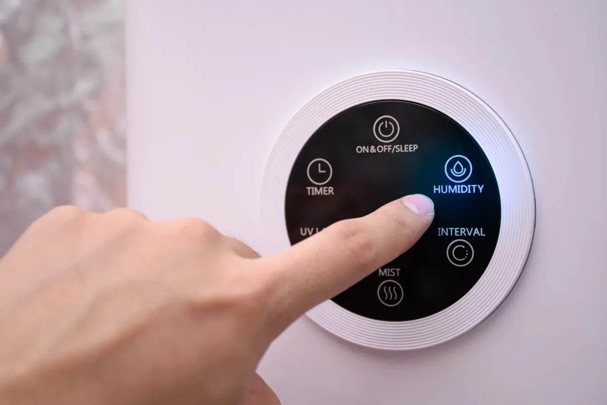 Air Quality - 8/15/25 Alt Text: Person's finger controlling humidity with their HVAC thermostat