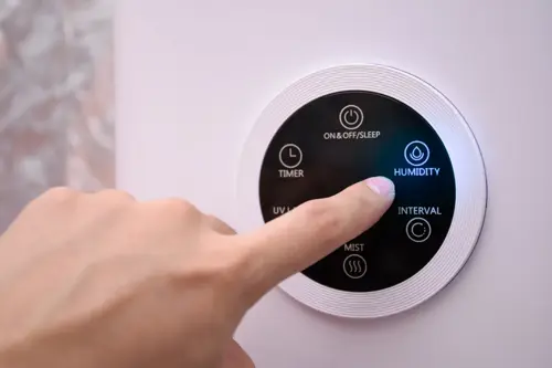 Air Quality - 8/15/25 Alt Text: Person's finger controlling humidity with their HVAC thermostat